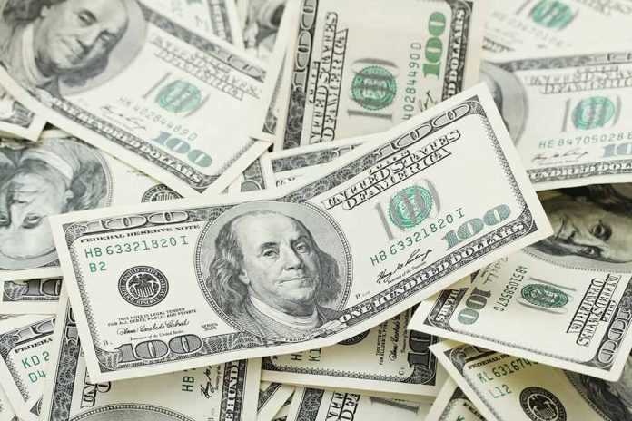 Multiple US one hundred dollar bills