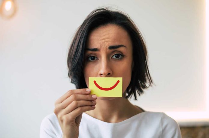 1705001518 featured image Woman holding a smiley face sticky note.