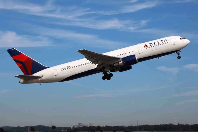 shutterstock_97178177.jpg Delta Airlines airplane taking off against a blue sky