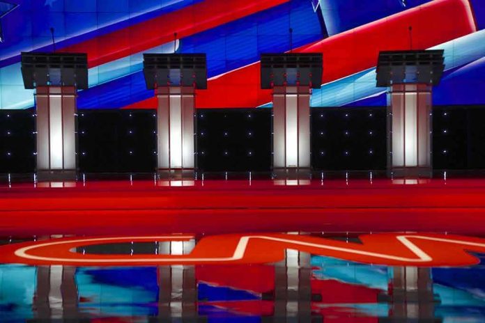 353120126 Four debate podiums on a CNN stage background