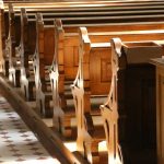 Church pews with sunlight streaming on them