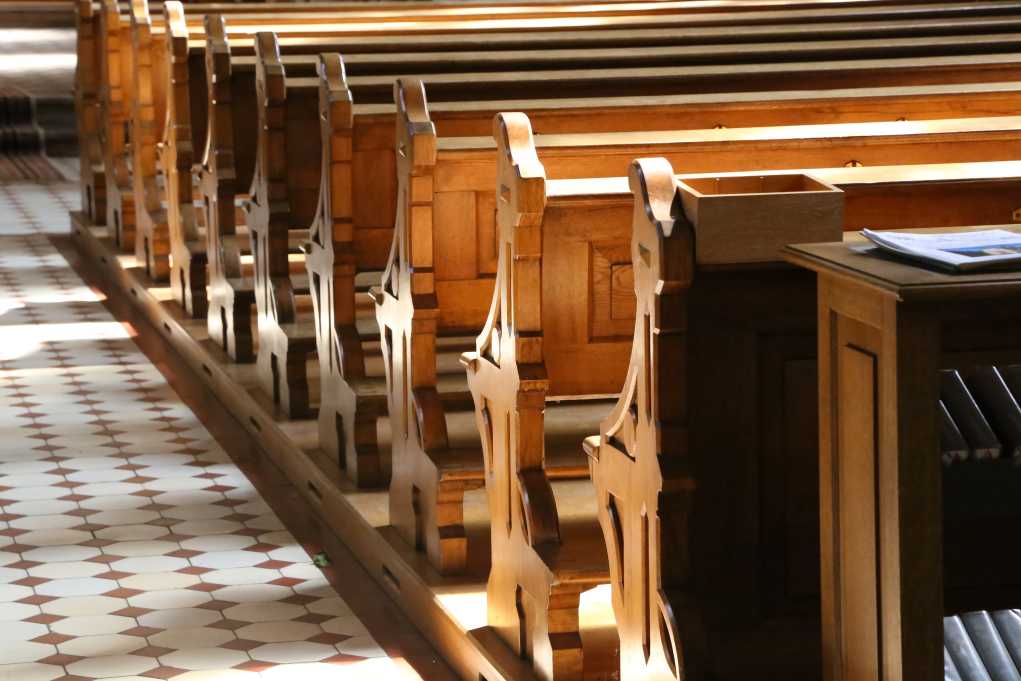 Church pews with sunlight streaming on them