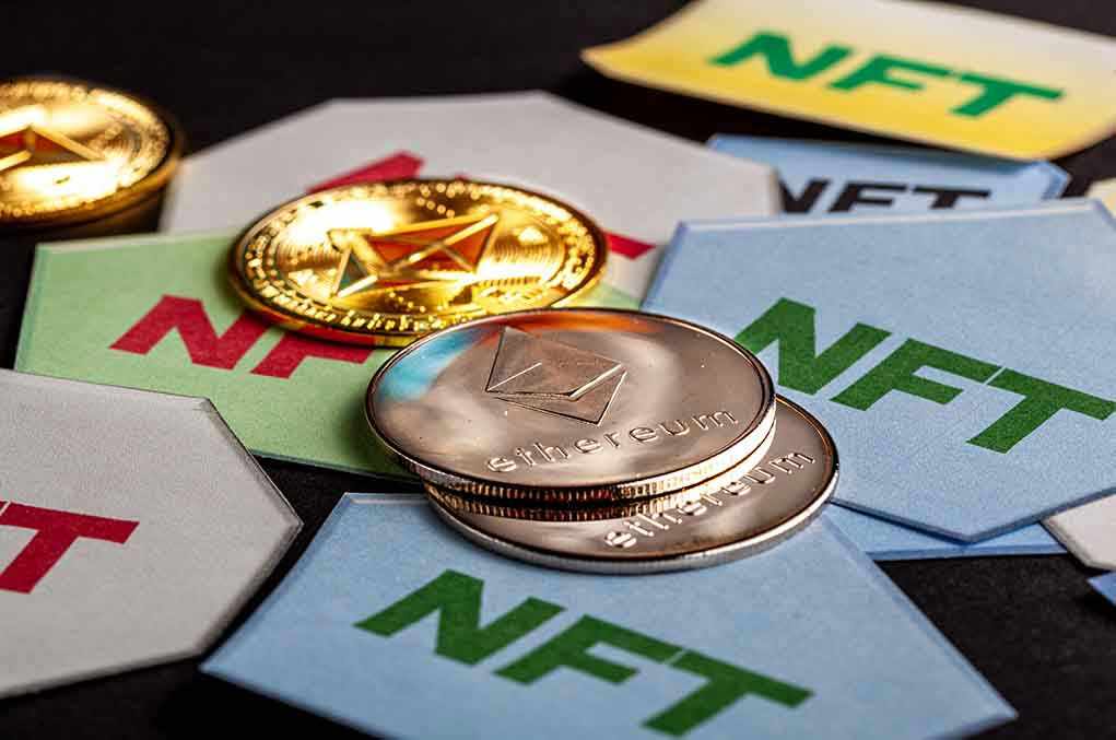 Ethereum coins on NFT cards background
