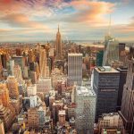 New York City skyline at sunset with tall buildings