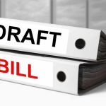 Two binders labeled Draft and Bill