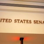 Sign displaying United States Senate in a government building