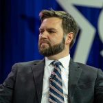 Vance Under Fire – Controversial Wife Comments Man in a suit with a thoughtful expression.