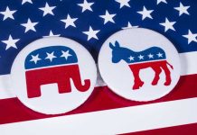 Insider Trading ACCUSATION Rocks Governor Race! Republican elephant and Democrat donkey on American flag.