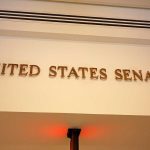 Senate FREEZES Fed Salaries—Cash Their OWN! Sign displaying United States Senate in a government building