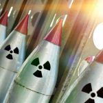 ALARMING Poll Exposes Nuclear War Expectations Line of nuclear missiles with radiation hazard signs.