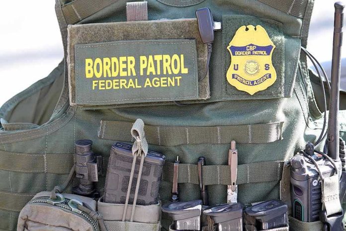1646704639 Border Patrol vest with gear and communication equipment.