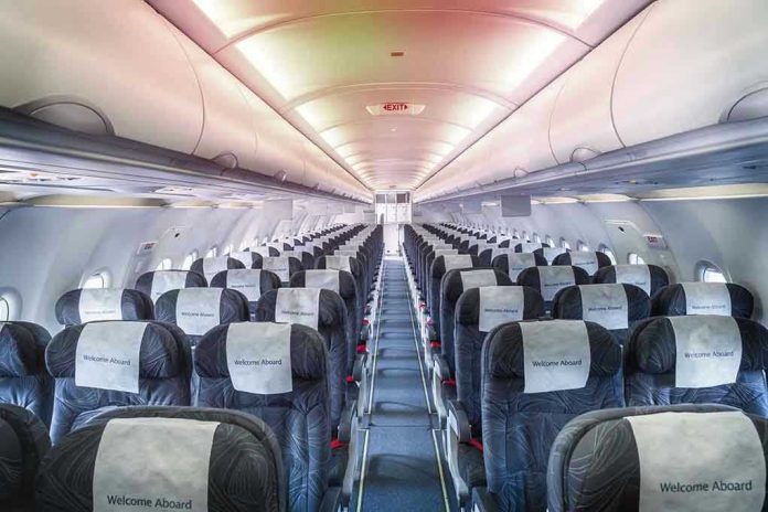 1889559274 Empty airplane cabin with rows of seats.