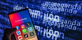 Smartphone showing social media apps with text background.