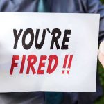 MASSIVE Verizon Bloodbath – 15,000 Workers AXED Person holding YOURE FIRED sign.