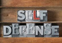 Self-Defense Law SHATTERED by Fatal Mistake Metallic block letters spelling SELF DEFENSE on wooden shelves.