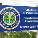 1,500 Flights Wiped + 6,500 Delayed—Airlines Scramble Sign for the Federal Aviation Administration at an air traffic control tower