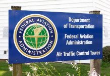 1,500 Flights Wiped + 6,500 Delayed—Airlines Scramble Sign for the Federal Aviation Administration at an air traffic control tower