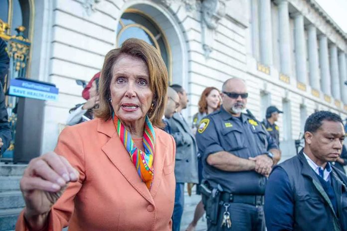 A woman in an orange blazer speaking passionately at a rally with security personnel in the background