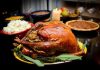 Toxic Metal Scare: Thanksgiving Staple UNDER FIRE A beautifully roasted turkey on a festive table surrounded by side dishes and decorations