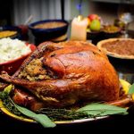 Toxic Metal Scare: Thanksgiving Staple UNDER FIRE A beautifully roasted turkey on a festive table surrounded by side dishes and decorations