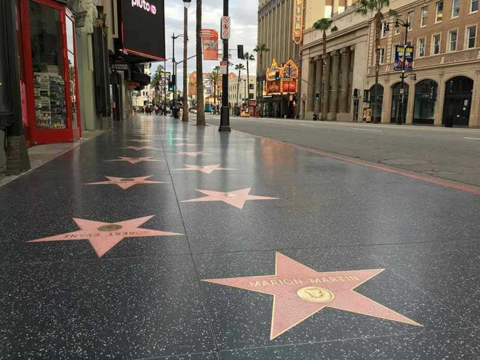 Hollywood Walk of Fame stars on sidewalk.