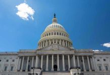 Congressional Hearing AMBUSHED – Protestors RUSH IN! U.S. Capitol building against a clear blue sky.