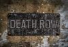 Death Row Inmate Walks Free – After 30-YEARS! Weathered Death Row sign on aged concrete wall