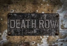 Death Row Inmate Walks Free – After 30-YEARS! Weathered Death Row sign on aged concrete wall