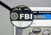 FBI Agents SUE Patel – Shocking Purge FBI website shown through magnifying glass.