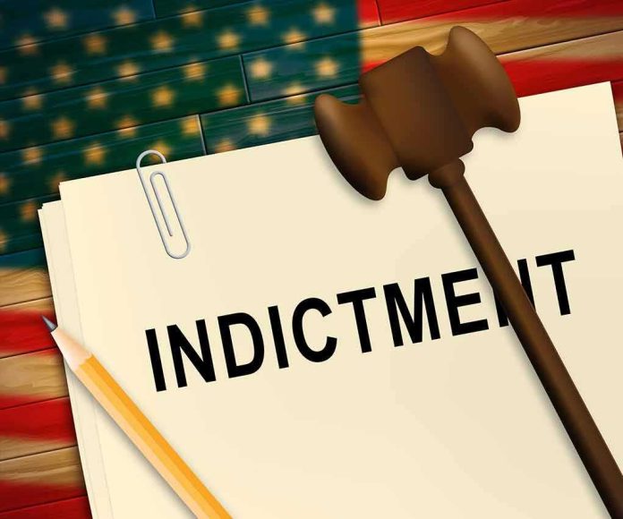 shutterstock_1435944215-2- A legal document labeled 'INDICTMENT' with a gavel and pencil
