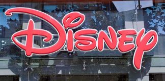 Disney’s MYSTERY Permits—New Park or Expansion Imminent! Bright red Disney logo displayed on a storefront window