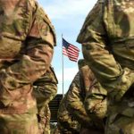 Army Prepares for First Military Executions in 65-Years! Soldiers stand in formation with American flag in background.