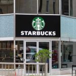 DOJ Targets Coffee Shop Over Congressman Ban Starbucks storefront with glass doors and logo