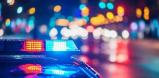 Babysitter From Hell ARRESTED – Shocking Negligence! Police car with flashing lights at night.