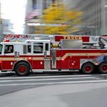 Woman KILLED By Firetruck Rushing To Emergency! Red fire truck driving through city street crosswalk
