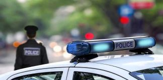 Shocking Body Cam Video – Dying Teen BEGS Cops To Stop! Police car and officer on a city street.