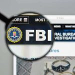 FBI CAPTURES MOST Wanted – He Was Hiding Where! FBI website shown through magnifying glass.