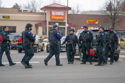 Police officers gathered outside King Soopers grocery store.