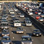 One DEAD – SUV Blows Up During Rush Hour! A busy highway filled with cars in a traffic jam