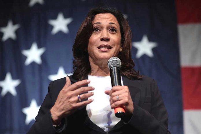 185042987 Woman speaking with microphone, American flag background.