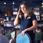 Daylight Heist Strikes Strip Club – $25K Vanishes In Singles Person receiving money from customer in a bar