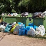 Trash Spies RUMMAGING Through Your Garbage For THIS! Overflowing garbage bins with bags on the ground.