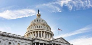 United States Capitol building under a blue sky