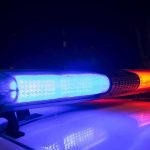 Champion Boxer KILLED in Road Rage Chaos Police car light bar flashing blue and red at night