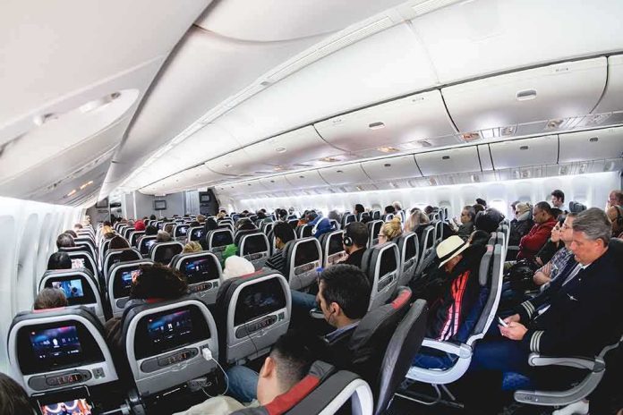 shutterstock_2013481865 Airplane cabin filled with passengers