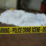 Body Found on Dem Reps Grass IDENTIFIED! crime scene tape in foreground with covered body in background