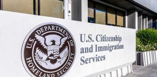 USCIS sign at a federal building entrance