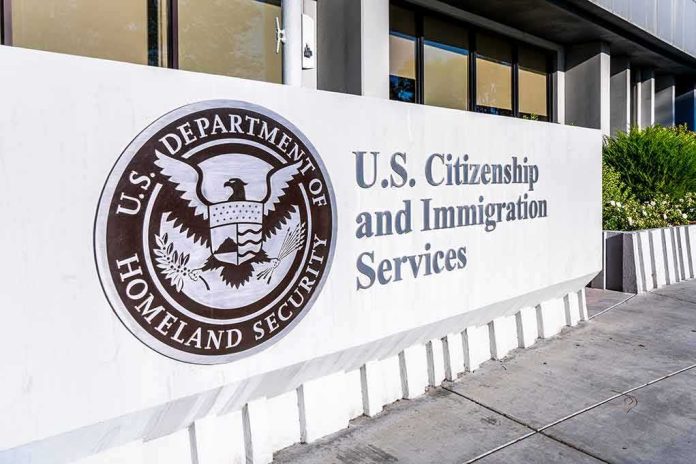 shutterstock_1590456970 USCIS sign at a federal building entrance