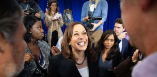 Kamala Harris smiling among supporters with Maya Harris nearby
