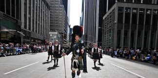 Scotland, Wales and Northern Ireland Call for Independence From the UK Participants in traditional Scottish attire marching in a parade on a city street